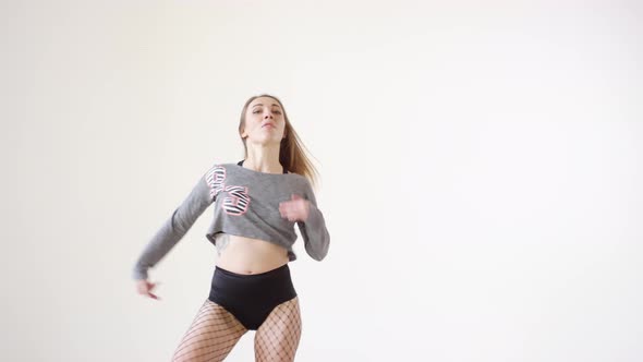 Young Female Dancer Performing Energetic Dancehall in Studio