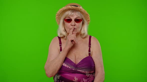 Elderly Woman Tourist Holding Finger Near Lips for Silence Sign Hush Secret Silence on Chroma Key