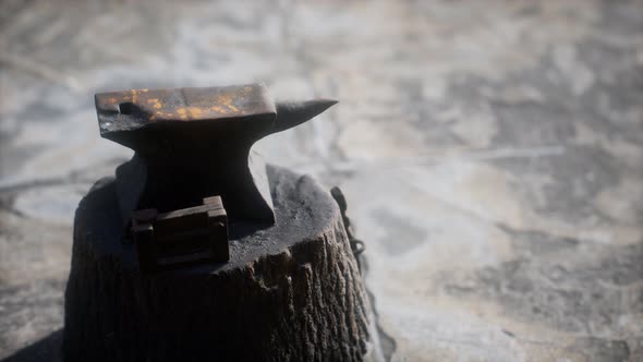 Old Anvil Attached To a Stump