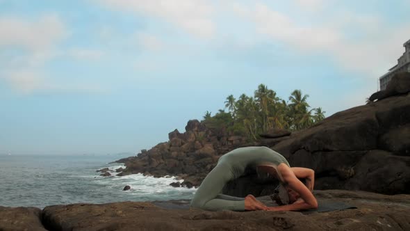 Yoga Practitioner Changes Hands Position at Sea Slow Motion