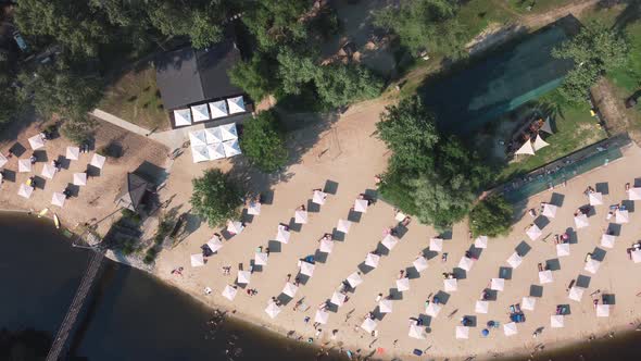 Aerial Top View of River Sand Beach with Lounges and Umbrellas