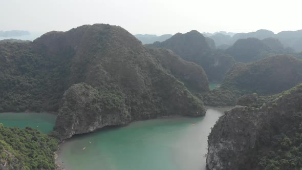 Aerial: unique flying over Ha Long Bay, famous tourism destination in Vietnam