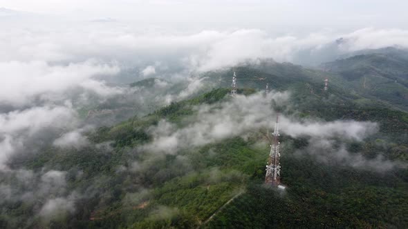 Aerial view low cloud move over the telecommunication tower