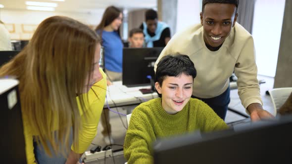 Young classmates studying together inside classroom - Education concept