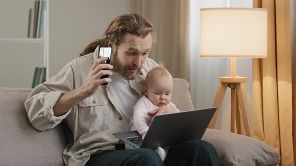 Busy Father Adult Business Man Single Dad Multitasking at Home Holding Little Daughter Newborn