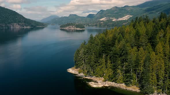 Men Catching Crabs In The Bay At Sechelt Inlet Surrounded With Mountains And Forest At Sunshine Coas