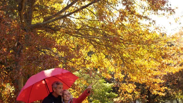 couple outdoors with umbrella