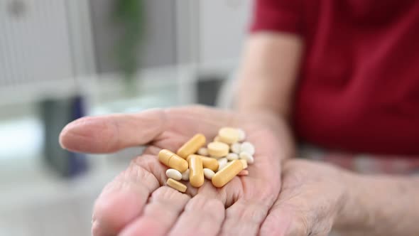 Senior Woman Taking Medicine