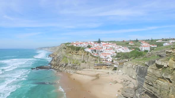 Aerial view of beach and cliffs next to Azenhas do Mar Village.