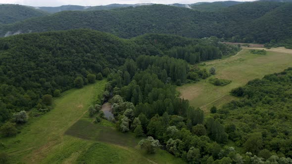 Drone flight over green mountain slopes