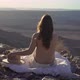 Young Woman Sitting Topless on Blanket at Edge of Fish River Canyon in Namibia - VideoHive Item for Sale