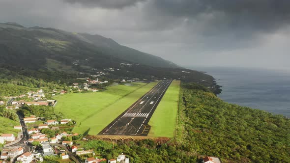 Short Runaway for Airplanes on Green Island of Sao Jorge at Cloudy Day Azores