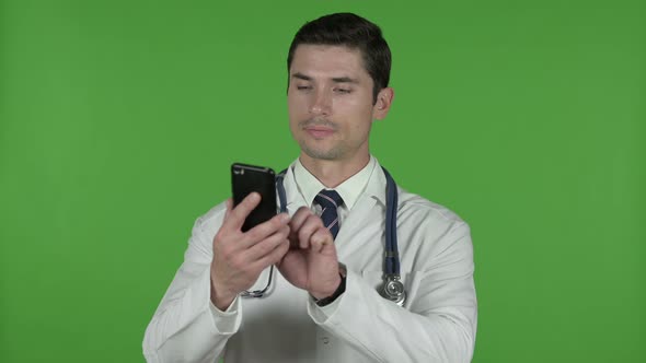 Ambitious Young Doctor Using His Cellphone, Chroma Key