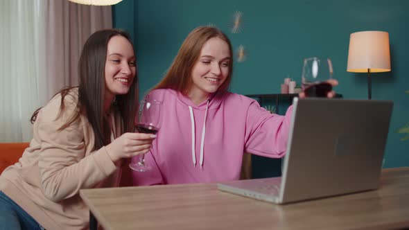Girls Friends Siblings Celebrate Online Holidays By Video Call Communicating on Webcam Using Laptop