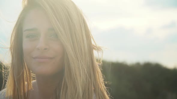 Portrait Cute Young Beautiful Woman with Amazing Blond Hair in the Wind