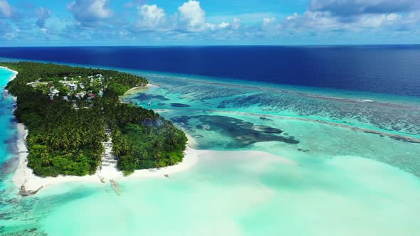 Aerial drone shot seascape of tropical bay beach lifestyle by blue lagoon with white sand background