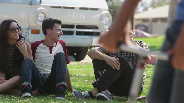 Group of young people hanging out at park