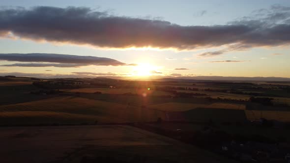 Shooting a Golden Sunset in the Countryside Near a Farm