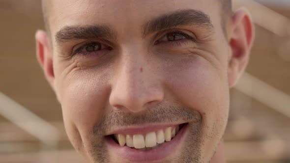 Portrait of a Smiling Gay Man Looking at the Camera