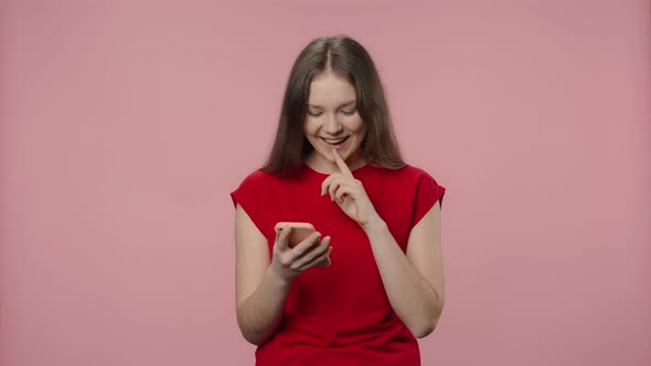 Portrait of Fashion Model Smiling and Texting on Her Phone