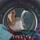 Woman finds her smartphone in the washing machine - VideoHive Item for Sale