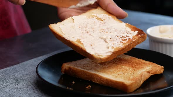 Fresh Butter Spreading on a Bread