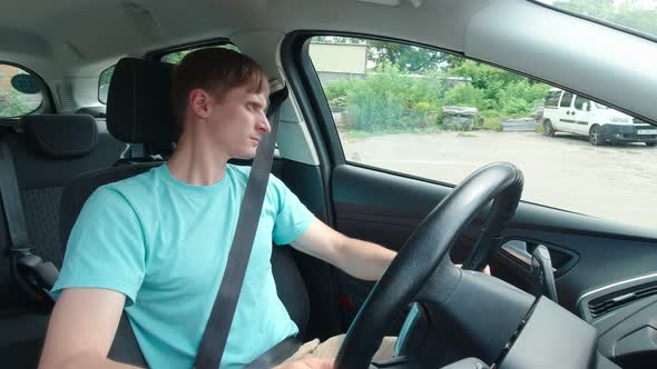 Man In Car Looks Around Slow Motion