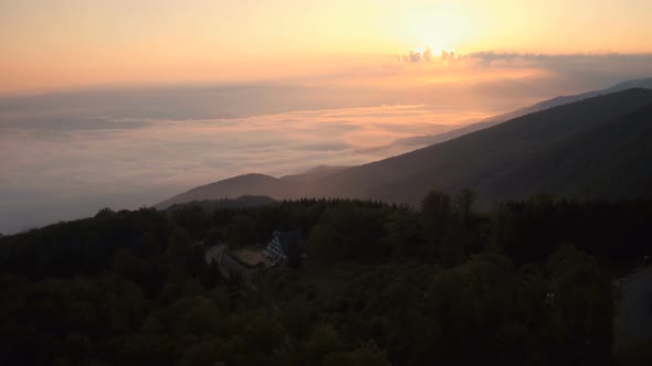 Aerial shot of a foggy valley in Transylvania