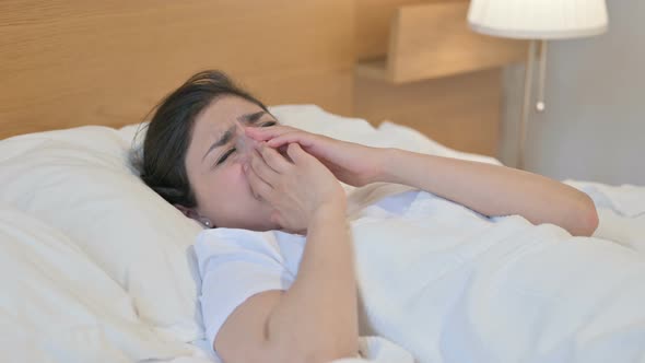 Young Indian Woman Crying While Sleeping in Bed