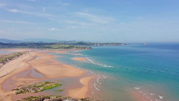 Huge beach in Liencres dunes natural park in north sunny Spain. Aerial