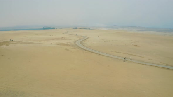 Flying over sand and desert in Paracas National Reserve in Peru 4K