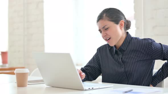 Young Indian Woman with Laptop Having Back Pain 