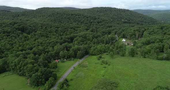 A drone pan from right to left over the epic scenery of the old round Catskill Mountains in upstate