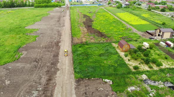 The work of the grader. Road leveling. Construction of the road.