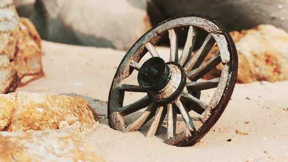 Old Tradition Waggon Wheel on the Sand