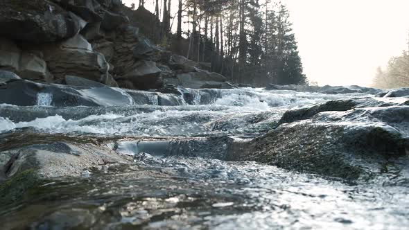 Raging Mountain River. Wildness of Clean, Clear Water in the Mountain River. Slow Motion