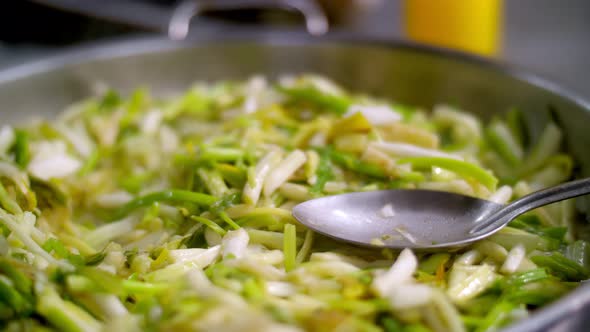 Cooking. Close-up. Vegetables Are Stewed in a Pan on the Stove, Steam Is Coming. Health Food