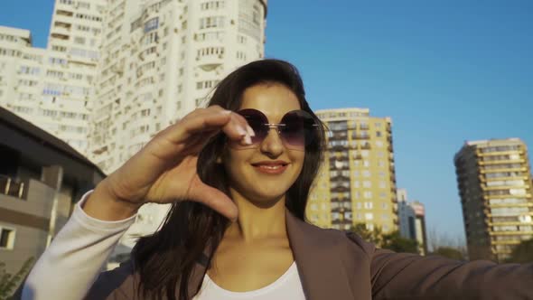 Beautiful Brunette Businesswoman In Business Clothes Walks In The City