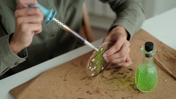 Woman Fixes Glass Plates