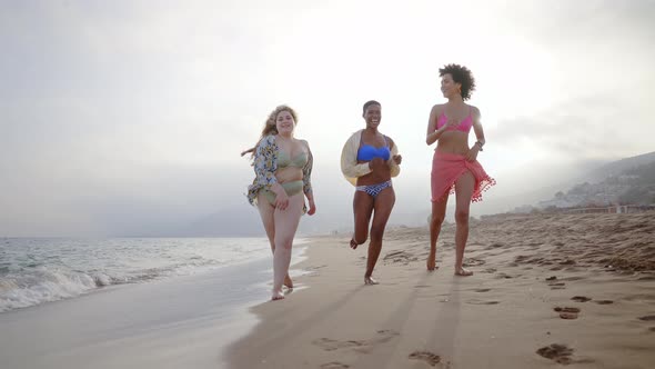 young women having fun on the beach