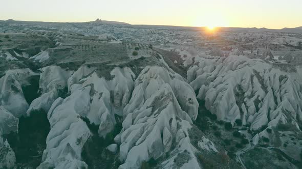 Sunset in cappadocia red valley landscape with horse riders