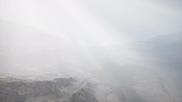 Sun Rays Against the Backdrop of the Mountains alt