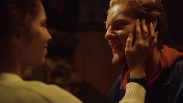 Two Lovers Enjoy Each Other By Fireplace