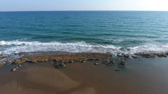 Shallow Rocky Reef Between the Sea and the Beach