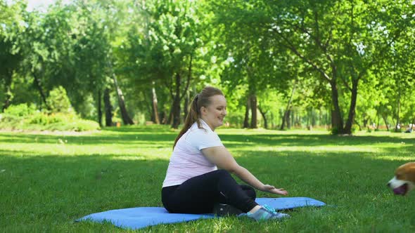 Cute Girl Playing With Dog, Short Break After Yoga in Park, Happy Life Moments