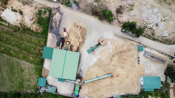 Aerial birdseye circling over timber woodworking place, Vietnam