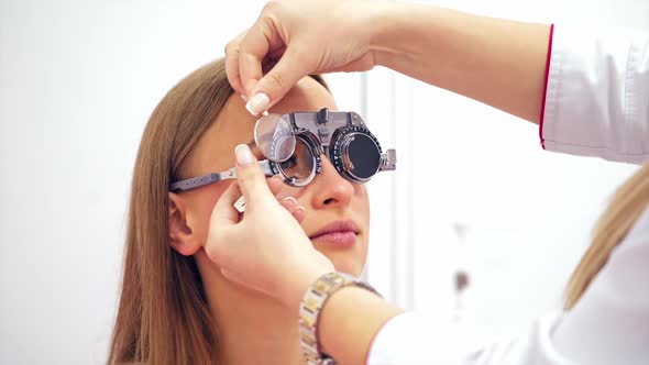 Doctor explains the results to a patient. An ophthalmologist confirms good results to a woman