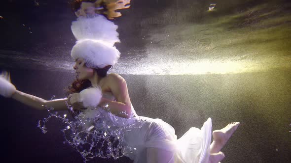 Sensual Woman in Snow Maiden Suit Underwater Slow Motion