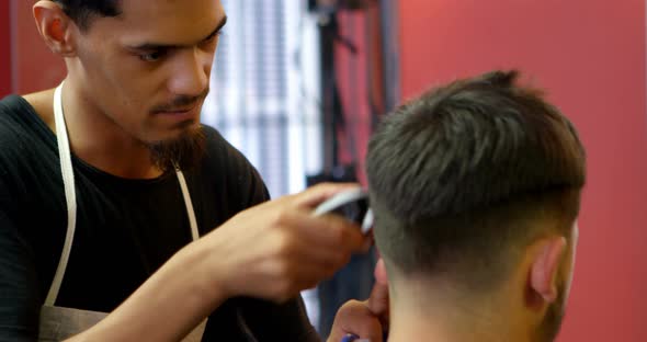 Man Getting His Hair Trimmed with Trimmer 4k