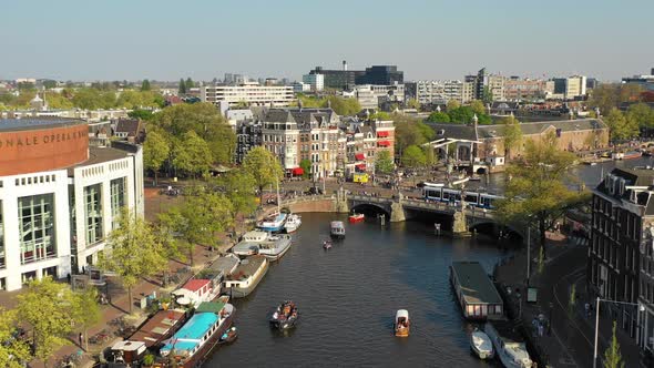 Aerial view of Amstel canal, Blauwbrug bridge in Amsterdam, Netherlands